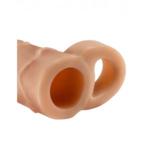 Close-up of a beige, textured cylindrical object with two open circular holes side by side. The material appears to be soft and flexible.