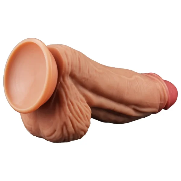 The Muscle 10 Inch Dual Layered Silicone Suction Cup Cock Dildo features realistic flesh tone, detailed veins, textured skin, testicles, and a sturdy suction cup base.