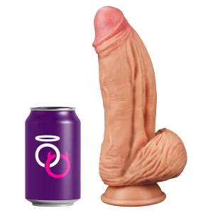 The Muscle 10 Inch Dual Layered Silicone Suction Cup Cock Dildo stands upright beside a purple soda can with Saints and Sinners logo, highlighting its realistic size and flesh-toned design for comparison.