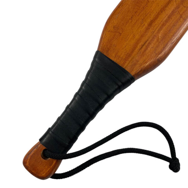saints and sinners wooden paddle handle close up