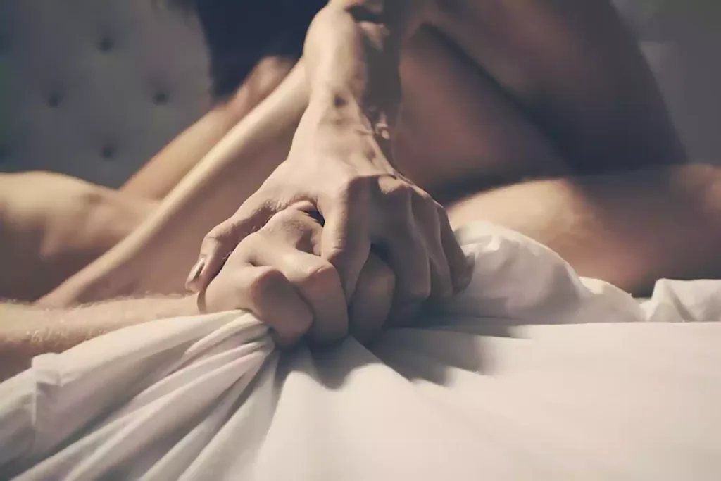 A couple practicing orgasm denial, with one partner in control