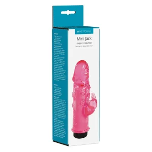 The retail packaging displays the Me You Us Mini Jack Rabbit Vibrator, featuring a pink vibrator with clitoral stimulator, product details, and branding on a white and teal background.