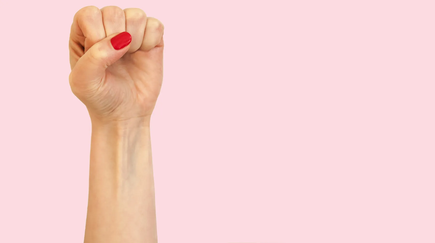 womans hand with a clenched fist