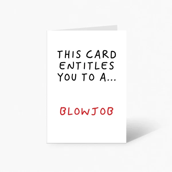 A white card with text in black and red letters. The card states, "THIS CARD ENTITLES YOU TO A..." in black, followed by the word "BLOWJOB" in red. The card is standing upright against a plain white background. The product name is This Card Entitles You To A Blowjob Card | The Inappropriate Card Company.