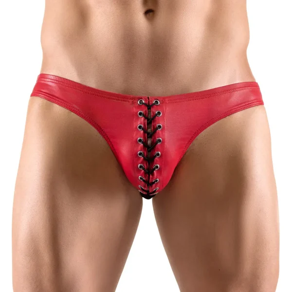 A person is modelling the Svenjoyment Red Briefs, featuring tight red material and black lace-up detailing at the front. The image focuses on the torso and waist area, highlighting the unique design and fabric of these briefs.