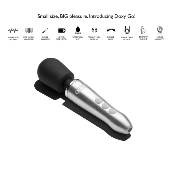 A Doxy Go Rechargeable Travel-Friendly Wand Massager in metallic and black rests on a white surface. Feature icons above highlight its strong vibrations, waterproof build, powerful motor, and body-safe silicone construction.
