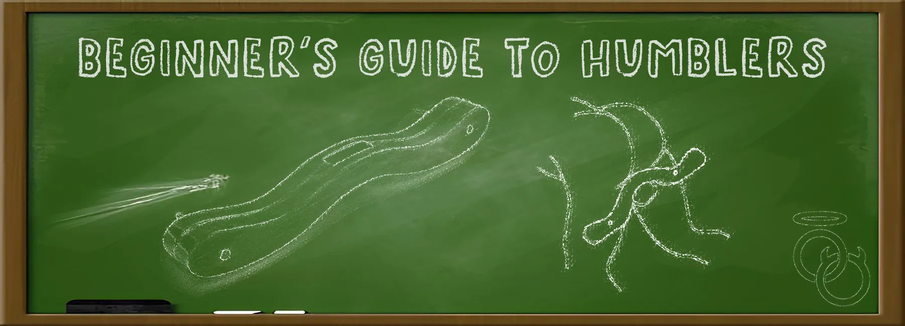 A green chalkboard displays the text "Beginner's Guide to Humblers" with chalk drawings of a humbler and a man using a humbler. A piece of chalk and an eraser rest on the board's wooden frame.
