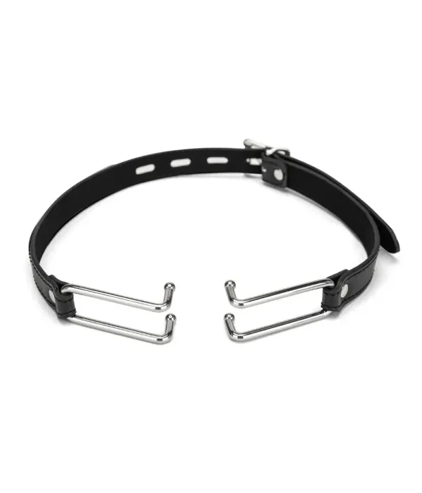 Black spider gag with metal prongs and adjustable holes, designed for use as a gag.