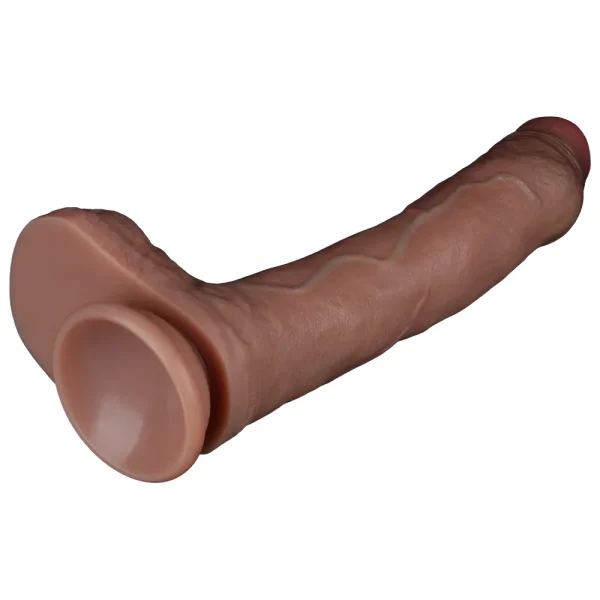 The Nature Cock 8.5 Inch Realistic Dual Layered Silicone Dildo is on its side, and shows the suction cup base at the bottom of the dildo.