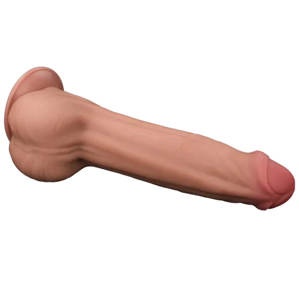 The Sliding Skin King Sized 11.5 inch Dual Layer Dildo features a realistic flesh-tone, pronounced head, textured veins, and a suction cup base, shown on its side against a white background.