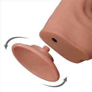 Close-up of a detachable suction cup base being screwed into the bottom of the Sliding Skin King Sized 11.5 inch Dual Layer Dildo, with arrows showing the twisting motion for attachment or removal.