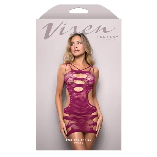 A woman in a magenta cut-out lace dress poses on the light gray packaging for the Fantasy Lingerie Vixen For The Thrill Dress. "For The Thrill Dress" is written at the bottom.