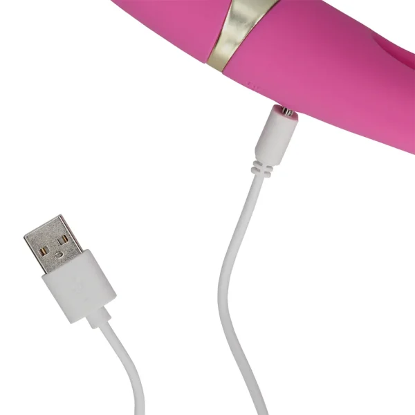 A close-up of the Loveline Double-Sided Flapping and G-Spot Vibrator, with a usb charging cable attached.