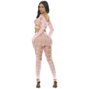 A woman with long dark hair with her back to the camera models the Pink Lipstick Tongue Twisted 2pc Crop Top and Leggings Set,a fitted, light pink outfit, wearing high heels and posing against a white background, looking over her shoulder.