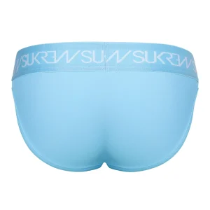 The Sukrew Breeze Blue U-Style Brief is light blue underwear seen from the back, with a wide waistband featuring "SUKREW" repeatedly in white. The fabric looks smooth and stretchy.