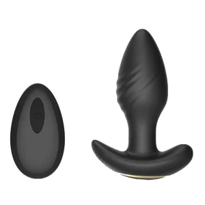 The Toosh Remote Controlled Silicone Rotating and Vibrating Butt Plug, in black with a textured surface and wide base, is pictured alongside its matching oval-shaped remote control.