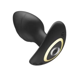 The Toosh Remote Controlled Silicone Rotating and Vibrating Butt Plug is angled showing the base with the power button light on indicating it is turned on.