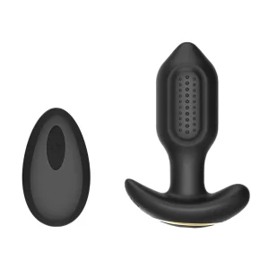 The Toosh Remote Controlled Silicone Vibrating Butt Plug, made of black silicone with sections of bumpy texture, is displayed beside its matching wireless remote on a plain white background.