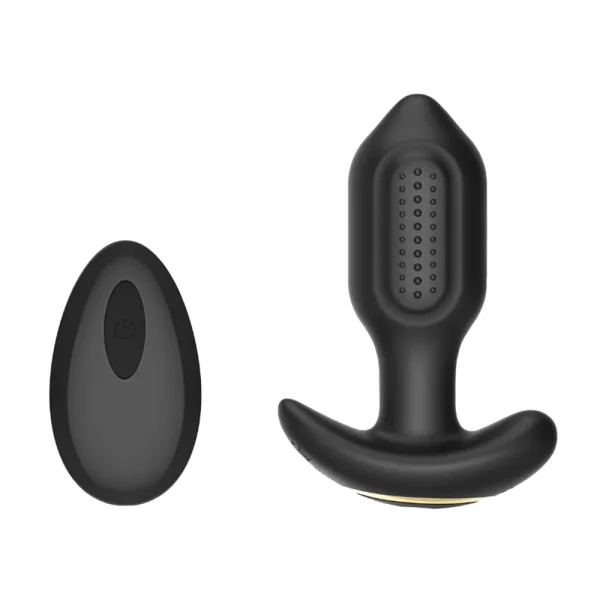 The Toosh Remote Controlled Silicone Vibrating Butt Plug, made of black silicone with sections of bumpy texture, is displayed beside its matching wireless remote on a plain white background.