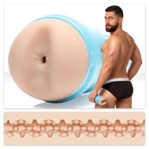 Griffin Barrows in black underwear holds the Fleshjack Boys Griffin Barrows Cake Butt Masturbator with its blue case; a close-up highlights the textured internal sleeve.