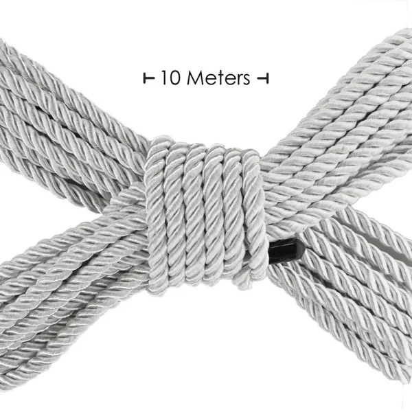 A neatly coiled length of silver Ouch 10 Metre Bondage Rope is arranged in an X shape, with a label above stating "10 Meters.