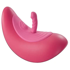 The VibePad Ride On Vibrating Remote Control Saddle Vibrator is a pink, saddle device with a textured attachment on top and both smooth and ribbed surfaces, shown against a plain white background.