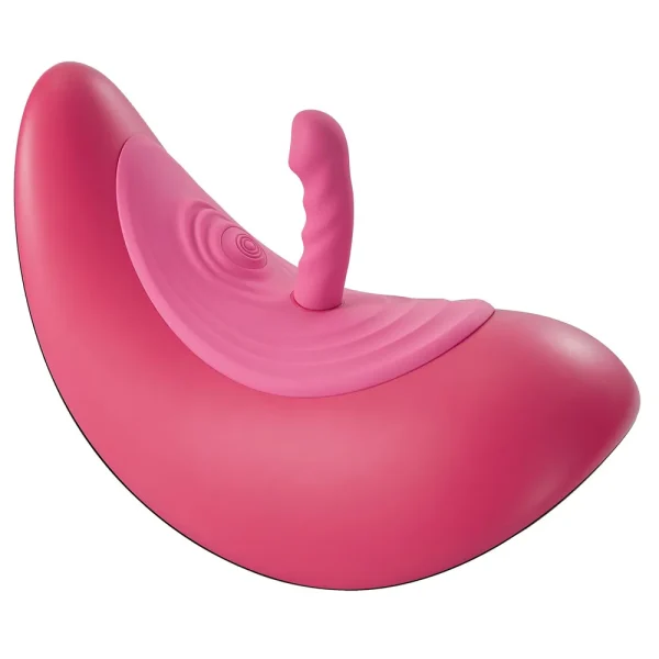 The VibePad Ride On Vibrating Remote Control Saddle Vibrator is a pink, saddle device with a textured attachment on top and both smooth and ribbed surfaces, shown against a plain white background.