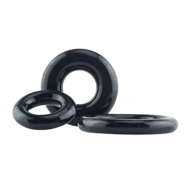 Three glossy black stretchy cock rings of varying sizes are arranged together on a white background.