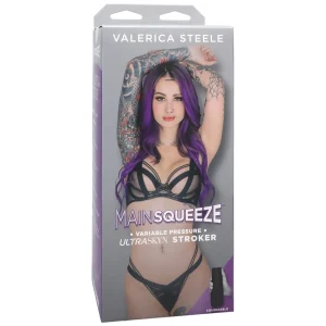 A product box features Val Steele with long purple hair, tattoos, and black lingerie. The label reads "Doc Johnson Main Squeeze Valerica Steele UltraSkyn Stroker" at the top.