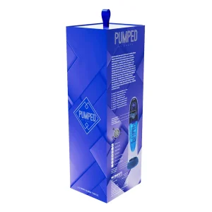 A tall, blue retail box labeled "PUMPED" displays images and descriptions of the Pumped Aqua Pro AI Enabled Submersible Automatic Penis Pump. The box features a blue handle on top and geometric design elements.