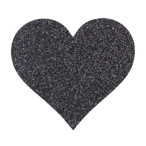 The Le Desir Nipple Cover Set features large black heart-shaped covers coated in fine, shiny glitter, set against a plain white background.