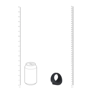 A standard soda can and the Levelz Silicone Cock and Ball Harness (a black, coiled ring) are displayed side by side with vertical rulers in inches (left) and centimeters (right) for size comparison.