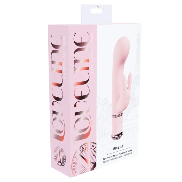 A box labeled "Loveline Paris Collection Belle Rabbit Vibe" features a pink 10-function rabbit vibrator, with an image of the toy and a subtle Eiffel Tower illustration in the background.