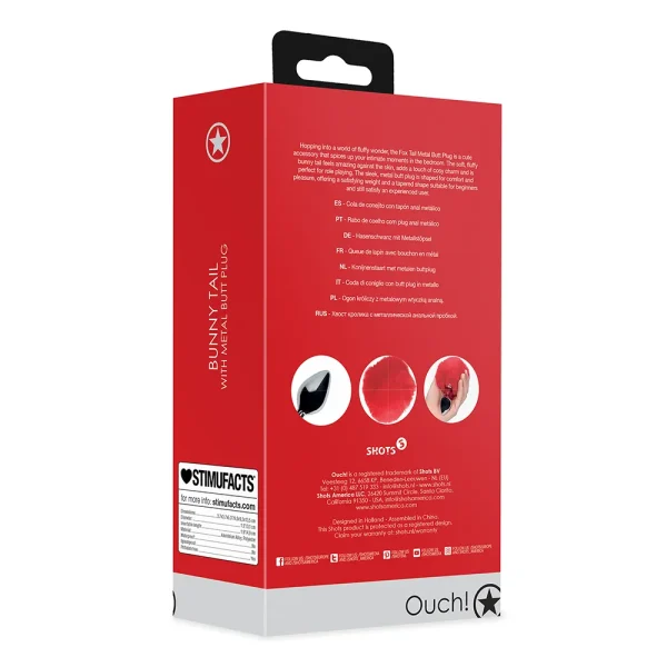 Back view of the Ouch Bunny Tail Metal Butt Plug red and white packaging with the brand logo at the bottom. The box displays images of a metal plug with a fluffy black tail, features in multiple languages, and a barcode.