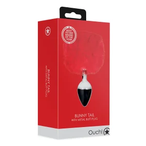 A retail box displays the "Ouch Bunny Tail Metal Butt Plug," featuring a red fluffy tail attached to a silver plug, branded "Ouch!" with a "Best Fetish Brand of the Year" badge on the packaging.