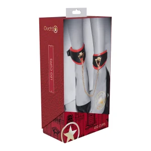 The front of the Ouch Milan Collection Leg Cuffs box features black and red padded leg cuffs linked by a gold chain, shown on a models legs. The packaging showcases a red and gold design with star graphics and text.