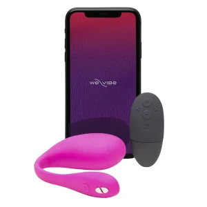 The We-Vibe Jive 2 App Controlled Rechargeable Love Egg Vibrator in pink is shown with a black remote control and a smartphone displaying the We-Vibe logo (implying smart phone app), all set against a white background.