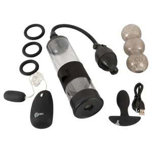 The Rebel 7-Piece Performance Sex Toy Set includes a clear pump with hose, three black silicone rings, a ribbed sleeve, a vibrating egg with remote, USB charging cable, and a black vibrating butt plug.