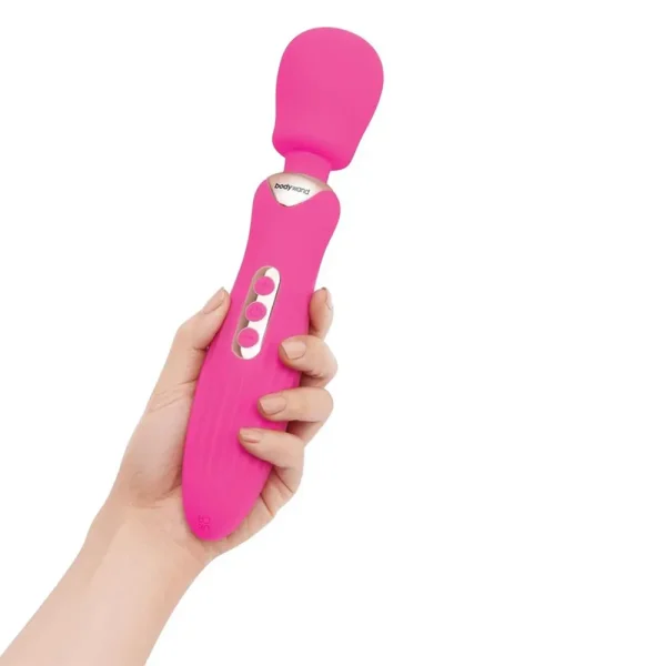 A hand holds the Bodywand Rumble Wand 10 Inch Rechargeable Massager, featuring a pink rounded head and three control buttons on the handle, set against a white background.