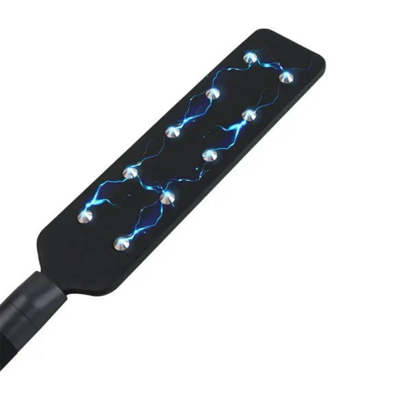 The Hidden Desire Extreme Electro Shock Paddle is a black paddle with visible blue electric sparks arcing between its metal studs to imply the electro stim functionality, set against a white background.