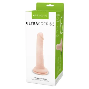 A retail box for the Me You Us Ultra Cock 6.5 Inch Realistic Dildo features a photo of the product with a suction cup base. The mainly white and green packaging displays product details.
