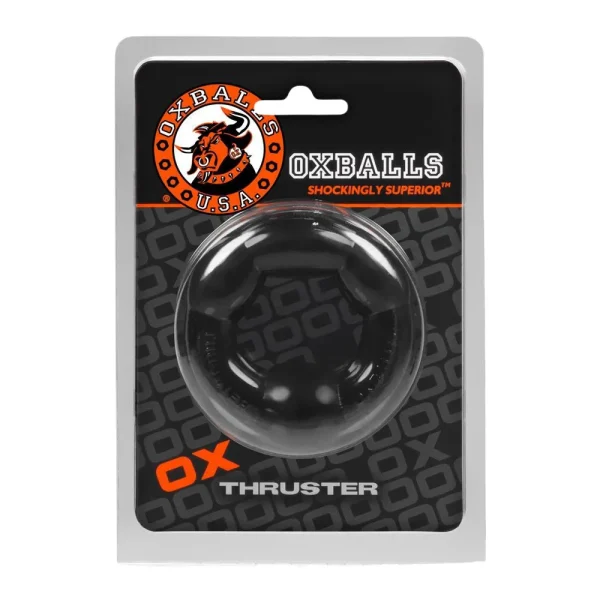 The Oxballs Thruster Cock Ring, made of black tpr, is shown in clear plastic packaging with a black and orange background. The top displays the Oxballs logo featuring an orange bull and bold branding.