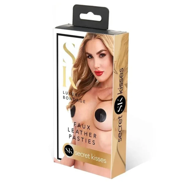 The Secret Kisses Faux Leather Pasties retail box features a woman modelling black circular pasties. The packaging is gold and white with branding.