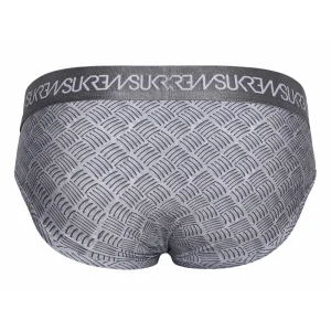 The image shows the back view of the Sukrew Checker Apex Brief: gray men's underwear with a textured metal pattern and a darker elastic waistband featuring repeated white "SUKREW" text.