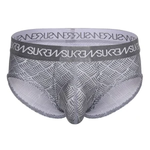 The Sukrew Checker Apex Brief is a gray men’s brief with a metal pattern and a matching waistband showcasing repeated white “SUKREW” text. The fabric is stretchy for a comfortable, form-fitting feel.