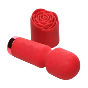 The Bloomgasm Pleasure Rose Petite Mini Silicone Rose Wand, a small red silicone massager with a detachable rose-shaped attachment, is pictured lying on its side against a white background.