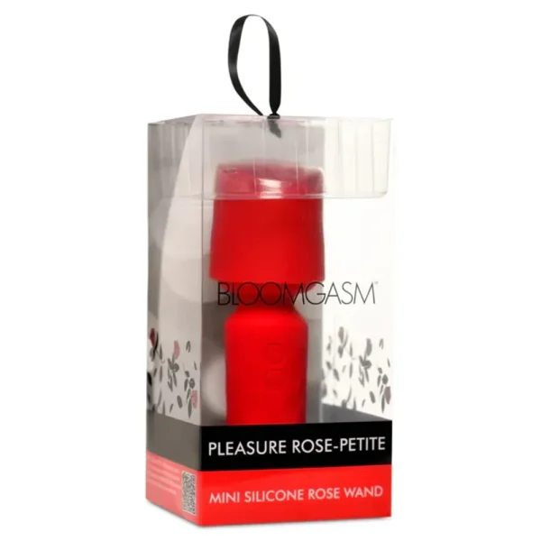 A packaged Bloomgasm Pleasure Rose Petite Mini Silicone Rose Wand in red is shown with floral designs and branding on the clear box, plus a black ribbon attached to the top for easy carrying.