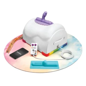 The Cowgirl Unicorn Premium Remote and App-Controlled Riding Sex Machine comes with a white main device featuring rainbow accents and a purple attachment, plus accessories, all displayed on a colourful circular mat.