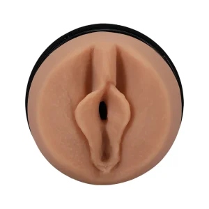 Close-up of the Doc Johnson Main Squeeze Kenzie Anne UltraSkyn Stroker, featuring a realistic vulva-shaped opening in a black circular case, shown against a white background.