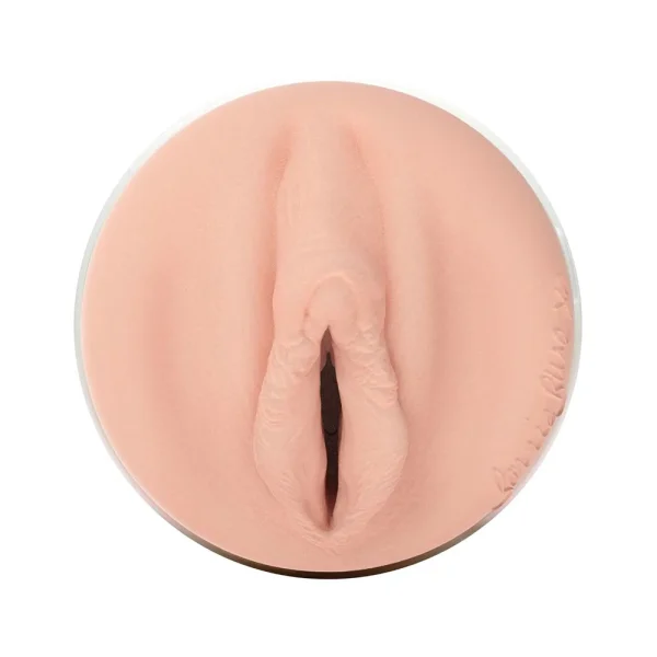 Close-up of the Fleshlight Girls Bonnie Blue 1K Texture Masturbator, featuring a realistic vulva-shaped opening in flesh tone, shown against a white background.
